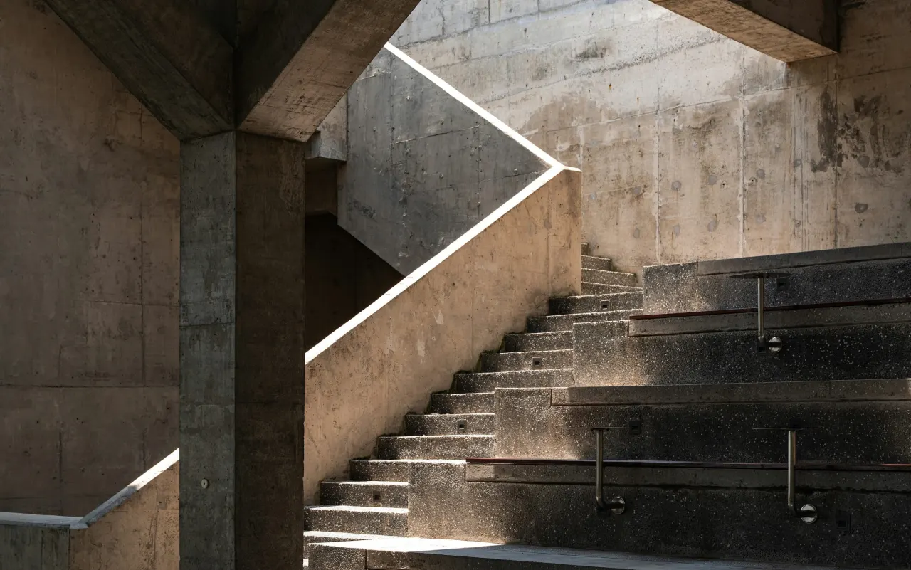 A concrete staircase under low light
